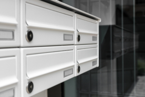 Mailboxes, with a modern design, positioned at the entrance of an apartment building.